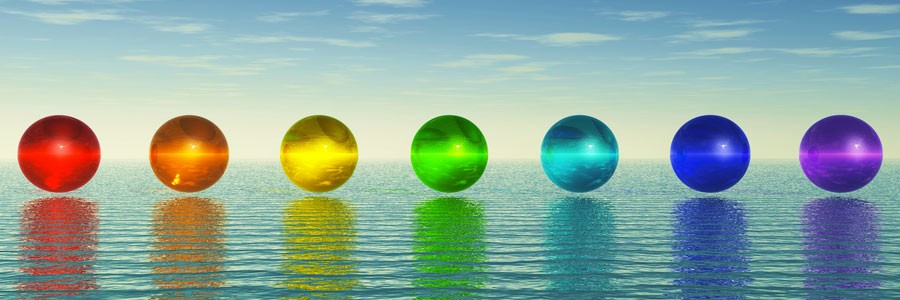 Illustration of chakras floating over the water and how we use chakras in Quantum Touch